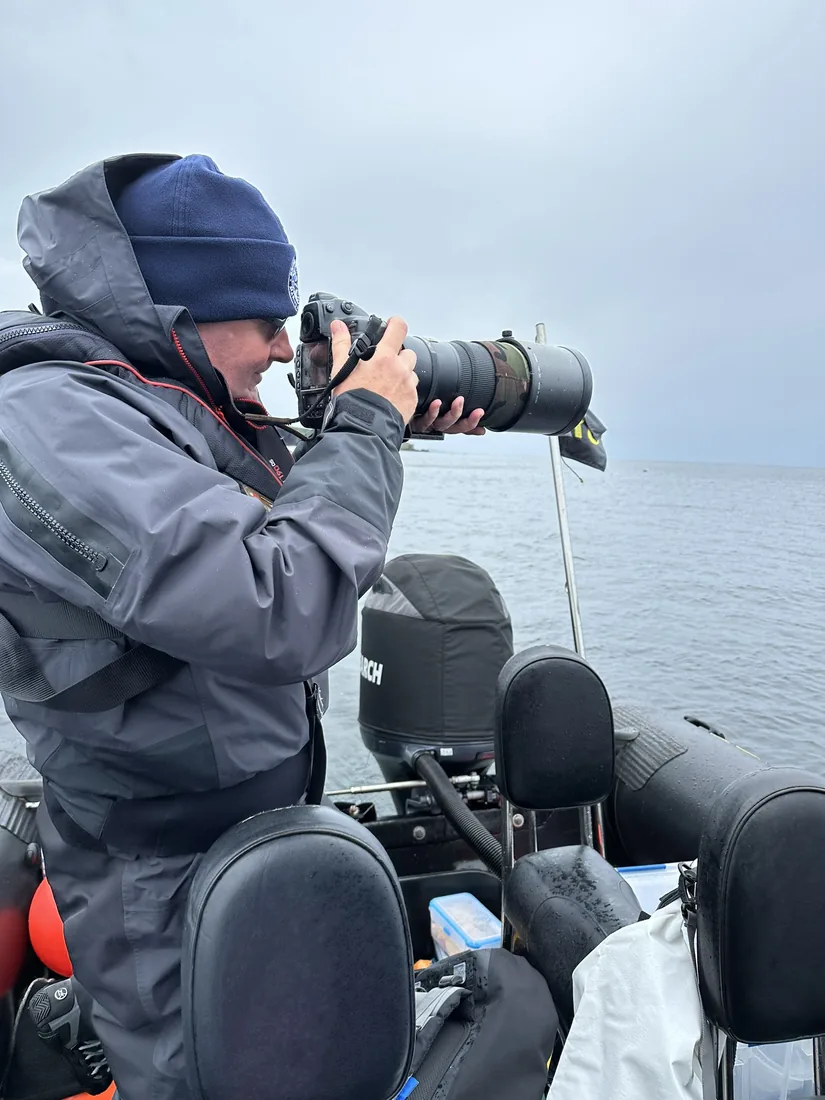 Andrew Grundy photographing from a RIB in UK waters